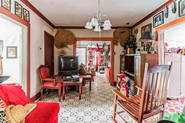 sitting room with an inviting chandelier and crown molding