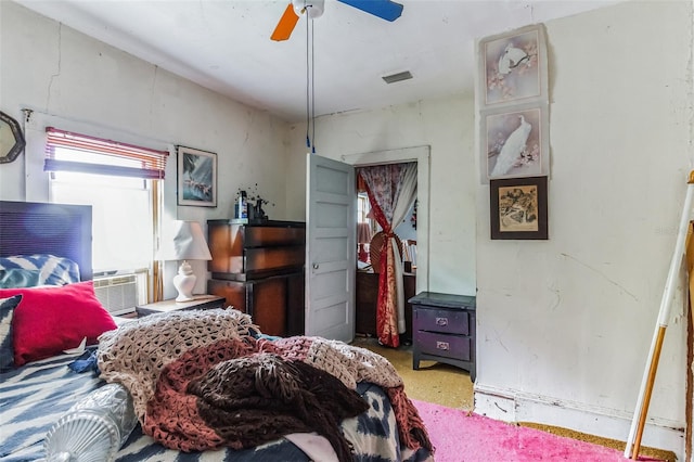 bedroom featuring ceiling fan and cooling unit