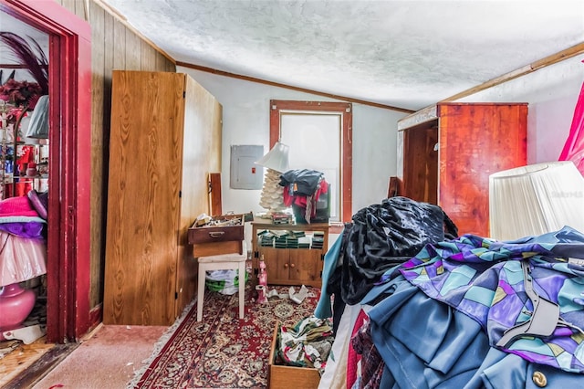 carpeted bedroom with ornamental molding, a textured ceiling, electric panel, and lofted ceiling