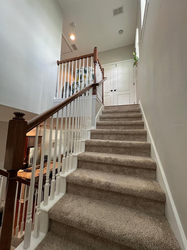 staircase with carpet