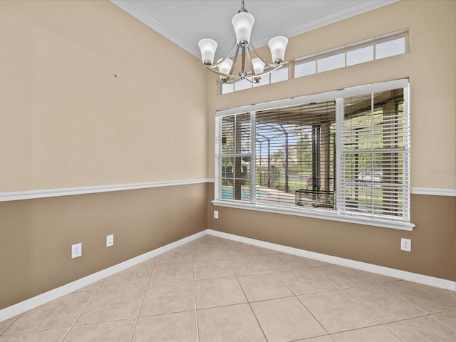 empty room featuring light tile patterned floors, baseboards, ornamental molding, and a chandelier