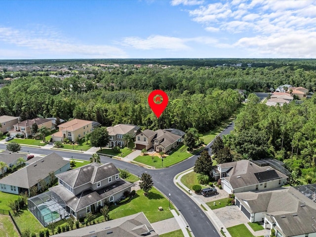 bird's eye view featuring a residential view and a view of trees