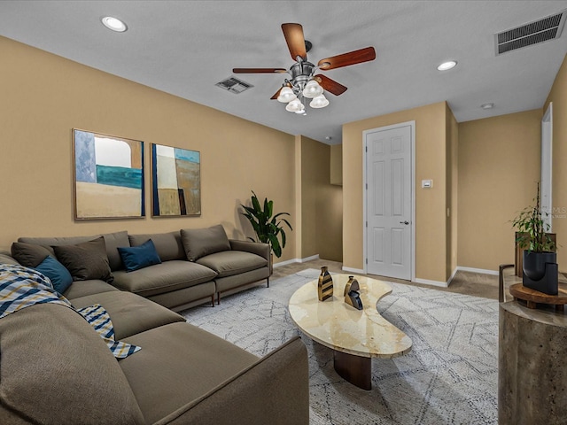 living room featuring baseboards, recessed lighting, visible vents, and light colored carpet