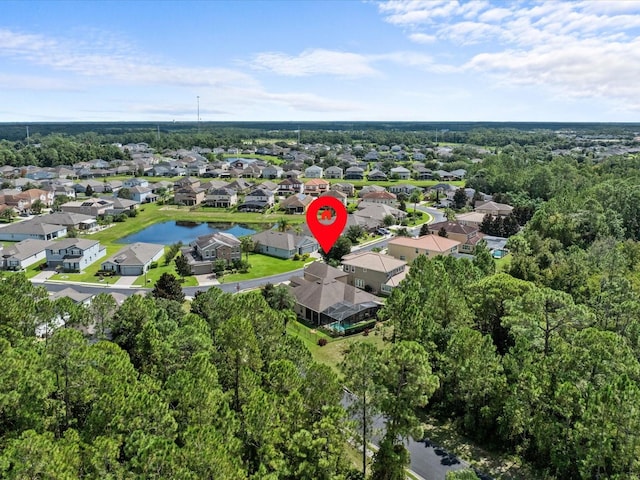 birds eye view of property with a residential view and a water view