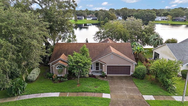 birds eye view of property with a water view