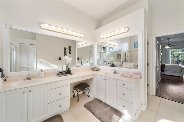 bathroom with wood-type flooring, ceiling fan, and vanity