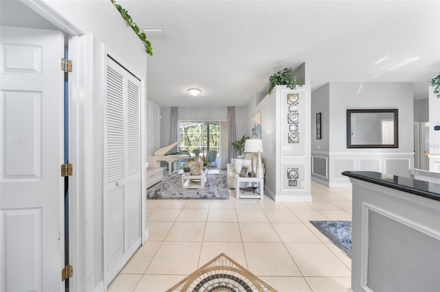 interior space with light tile patterned floors