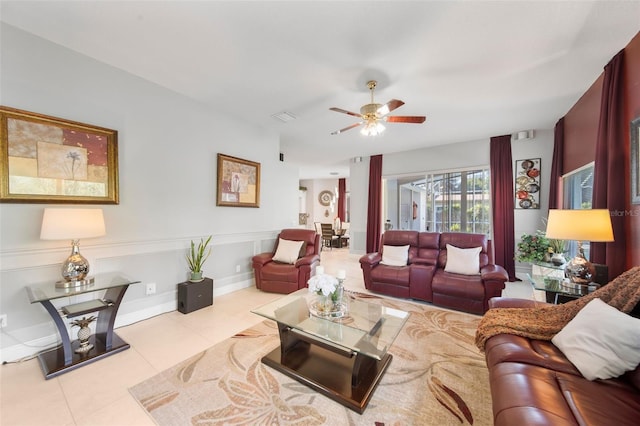 tiled living room featuring ceiling fan