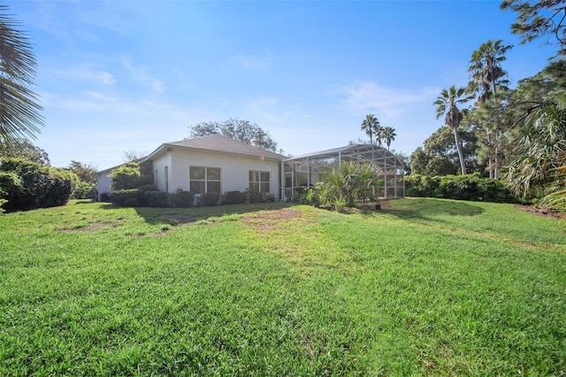 view of yard with a lanai