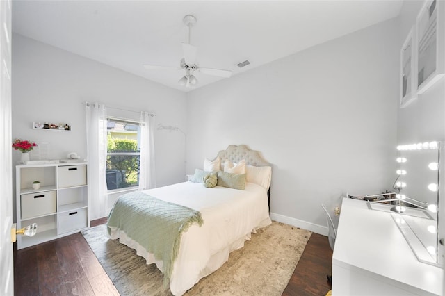 bedroom featuring dark hardwood / wood-style flooring and ceiling fan