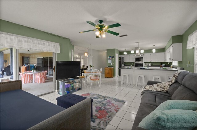 2101 Appy Ln, Apopka, FL 32712 - living area featuring a ceiling fan and light tile patterned flooring