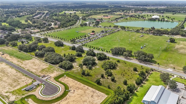 bird's eye view with a water view and a rural view