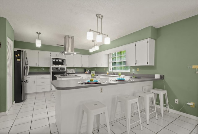 2101 Appy Ln, Apopka, FL 32712 - kitchen with black appliances, a peninsula, white cabinets, a textured ceiling, and light tile patterned floors