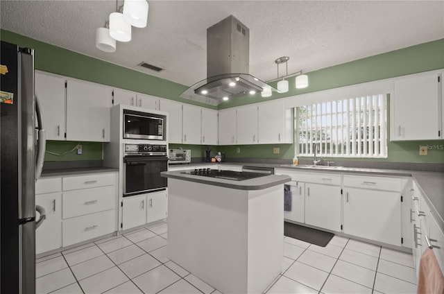 2101 Appy Ln, Apopka, FL 32712 - kitchen with black appliances, island range hood, a textured ceiling, white cabinetry, and light tile patterned floors