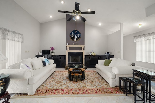2101 Appy Ln, Apopka, FL 32712 - living area with tile patterned floors, lofted ceiling, a tiled fireplace, and ceiling fan