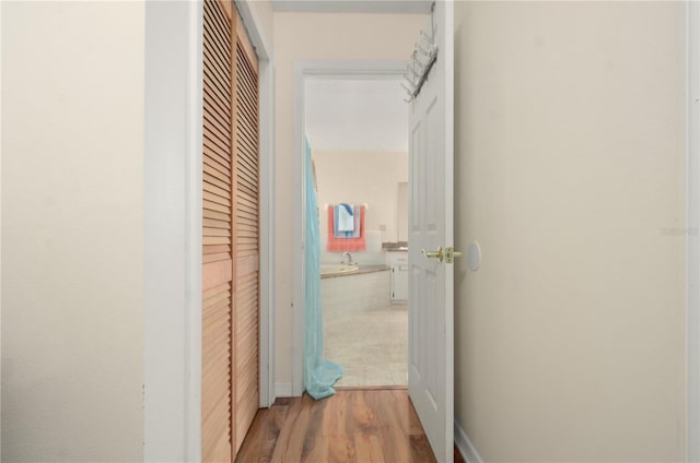 2101 Appy Ln, Apopka, FL 32712 - hall featuring wood finished floors and a sink