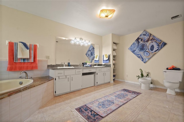 2101 Appy Ln, Apopka, FL 32712 - bathroom with a bidet, tile patterned flooring, double vanity, and a bath