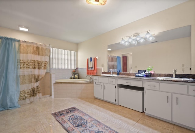 2101 Appy Ln, Apopka, FL 32712 - full bathroom with double vanity, tile patterned floors, a bath, and a shower