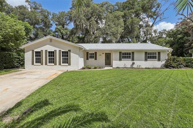 ranch-style house with a front lawn