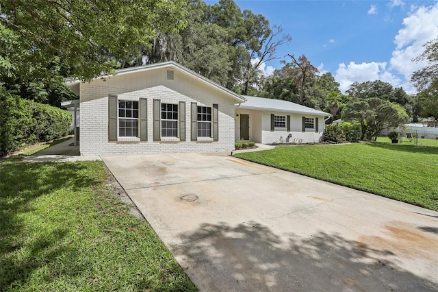 ranch-style house with a front lawn