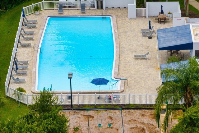 view of swimming pool featuring a patio area