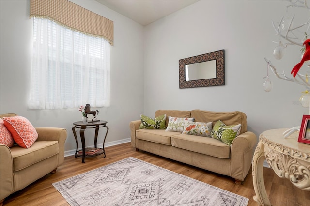 living room with wood finished floors and baseboards