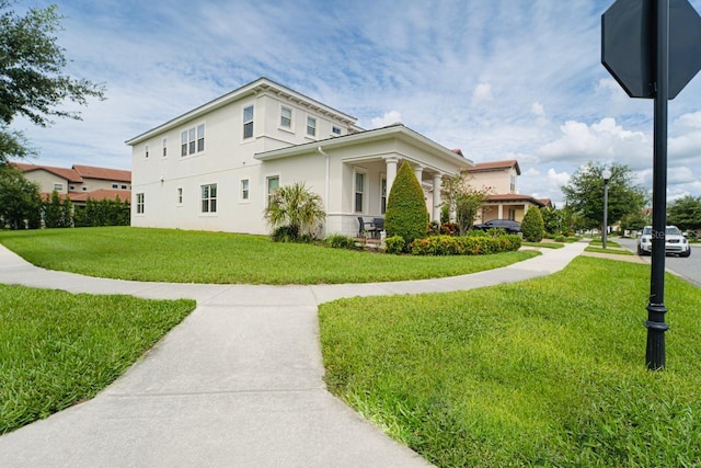 view of side of home featuring a lawn