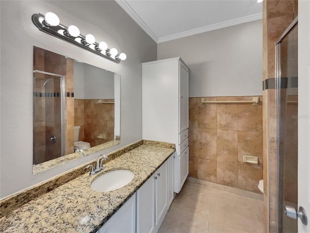 full bath featuring a shower stall, crown molding, toilet, tile patterned floors, and tile walls