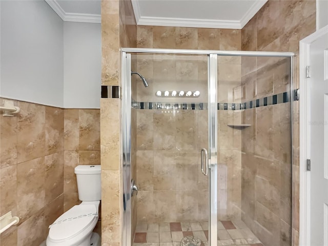 bathroom featuring ornamental molding, tile walls, toilet, and walk in shower