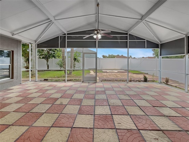 unfurnished sunroom with lofted ceiling and ceiling fan