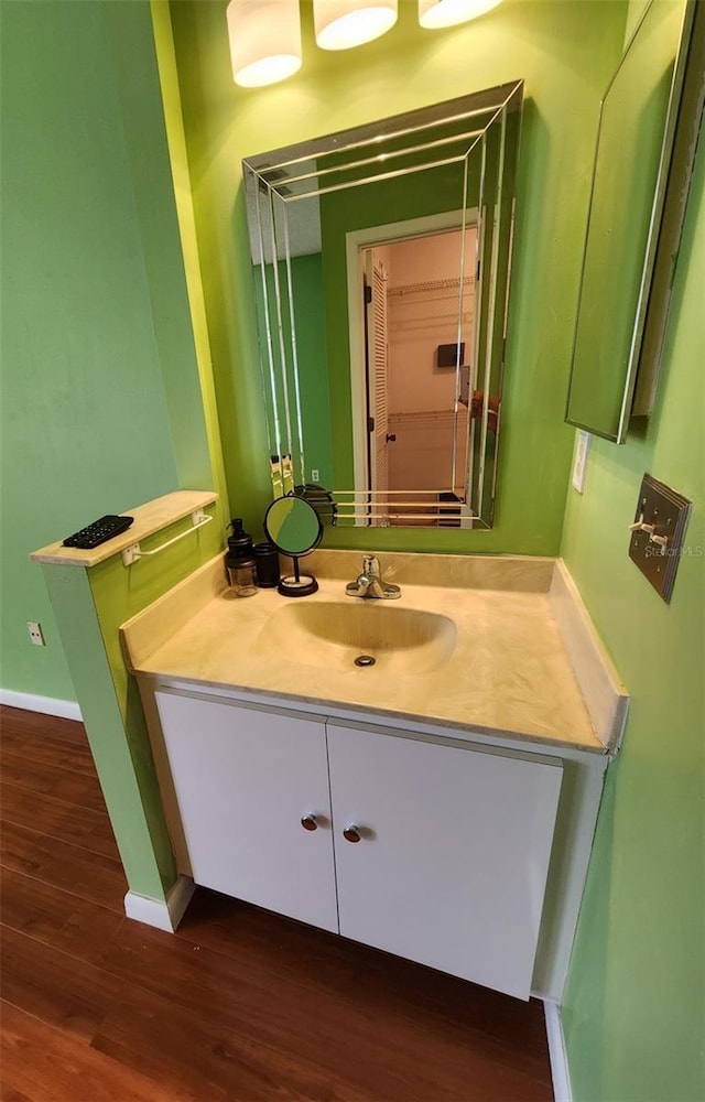 bathroom with wood-type flooring and vanity