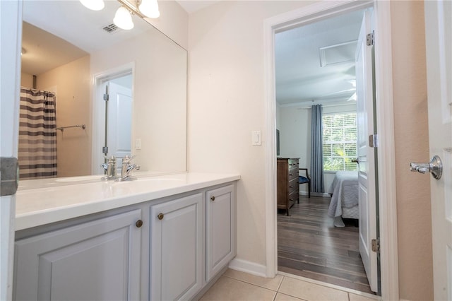 bathroom with hardwood / wood-style flooring and vanity