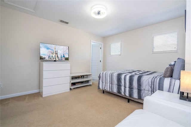 bedroom featuring multiple windows and light carpet