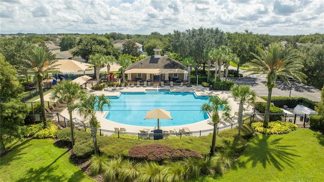 view of swimming pool with a lawn and a patio area