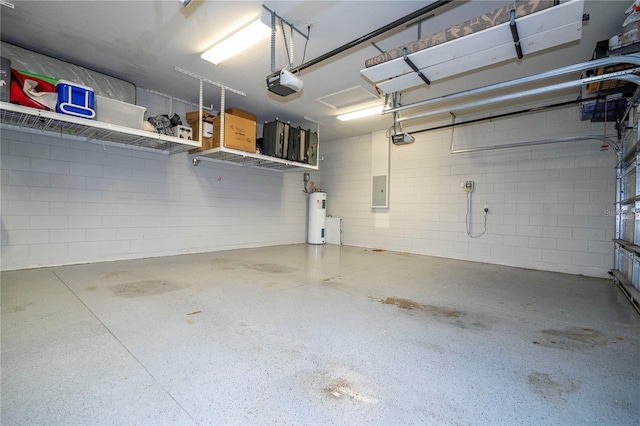 garage featuring electric water heater, electric panel, and a garage door opener