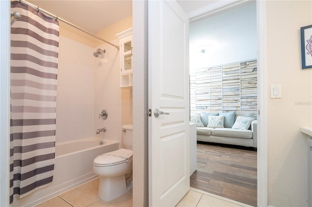 full bathroom with shower / tub combo with curtain, vanity, and toilet