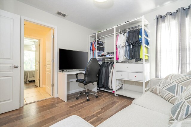 office with dark wood-type flooring