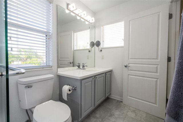 bathroom with toilet and vanity