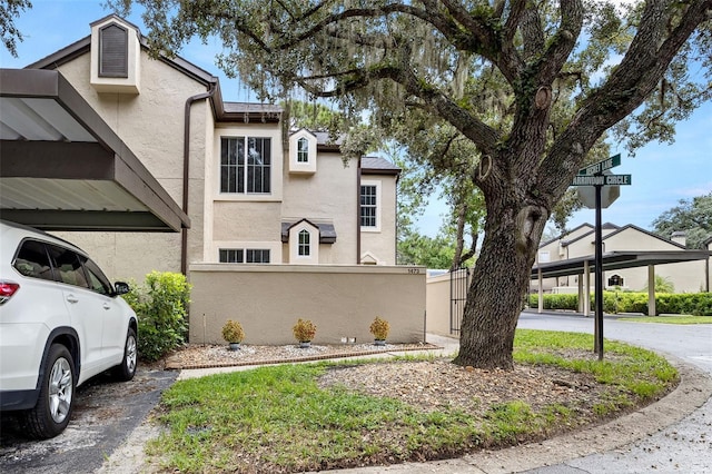 1473 Farrindon Cir, Lake Mary, FL 32746 - view of home's exterior with stucco siding and a fenced front yard
