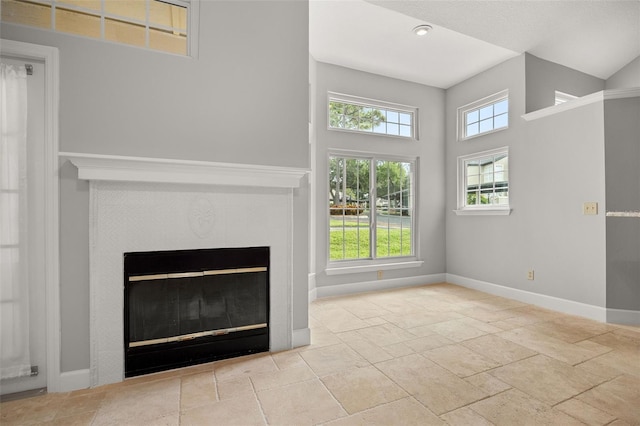 unfurnished living room with a towering ceiling