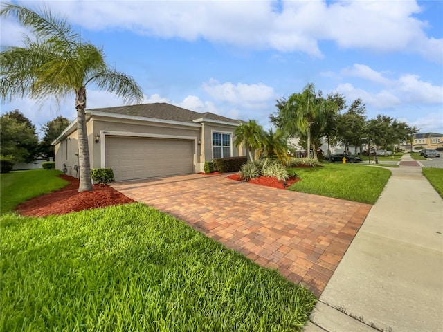 view of front facade featuring a garage and a front lawn