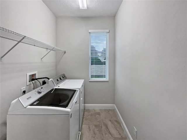 washroom featuring washer and dryer