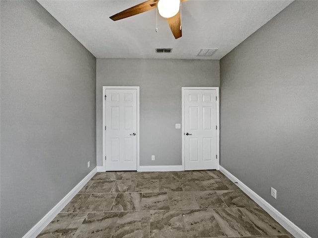 spare room with ceiling fan