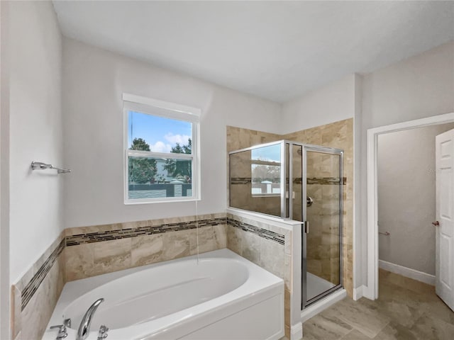 bathroom with shower with separate bathtub