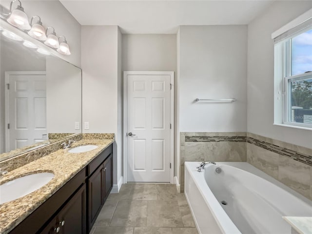 bathroom with vanity and a bathtub