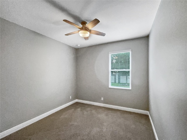 unfurnished room with ceiling fan and carpet floors