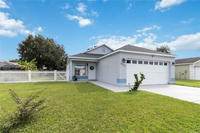 ranch-style home with a front lawn and a garage