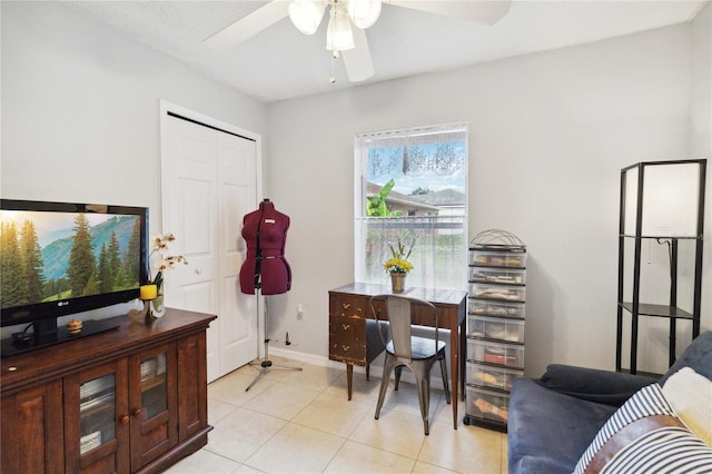 tiled home office with ceiling fan