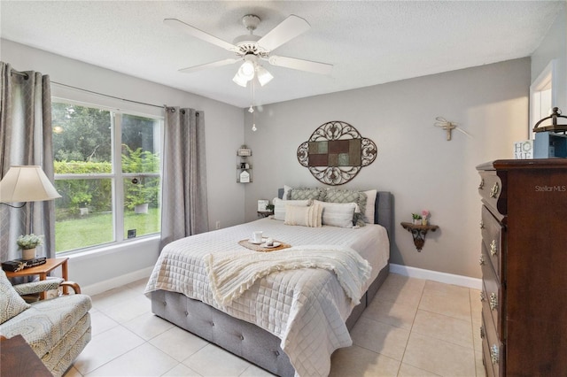 bedroom featuring multiple windows, light tile patterned floors, and ceiling fan