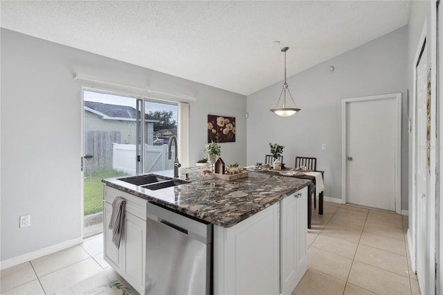 kitchen featuring decorative light fixtures, white cabinetry, dishwasher, sink, and a kitchen island with sink